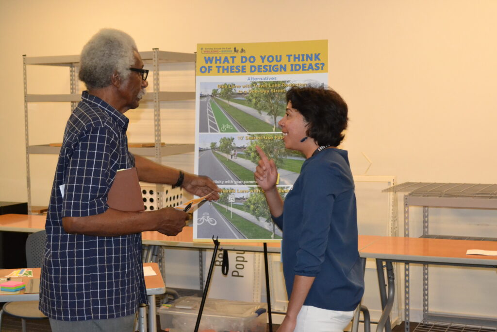 Public meeting attendees engaged in discussion